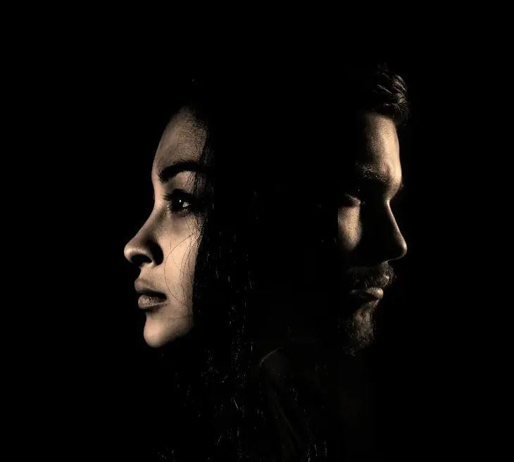 Two people facing apart